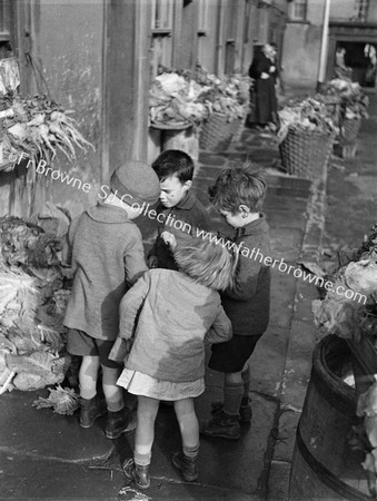 CHILDREN AT VEGATABLE SHOP